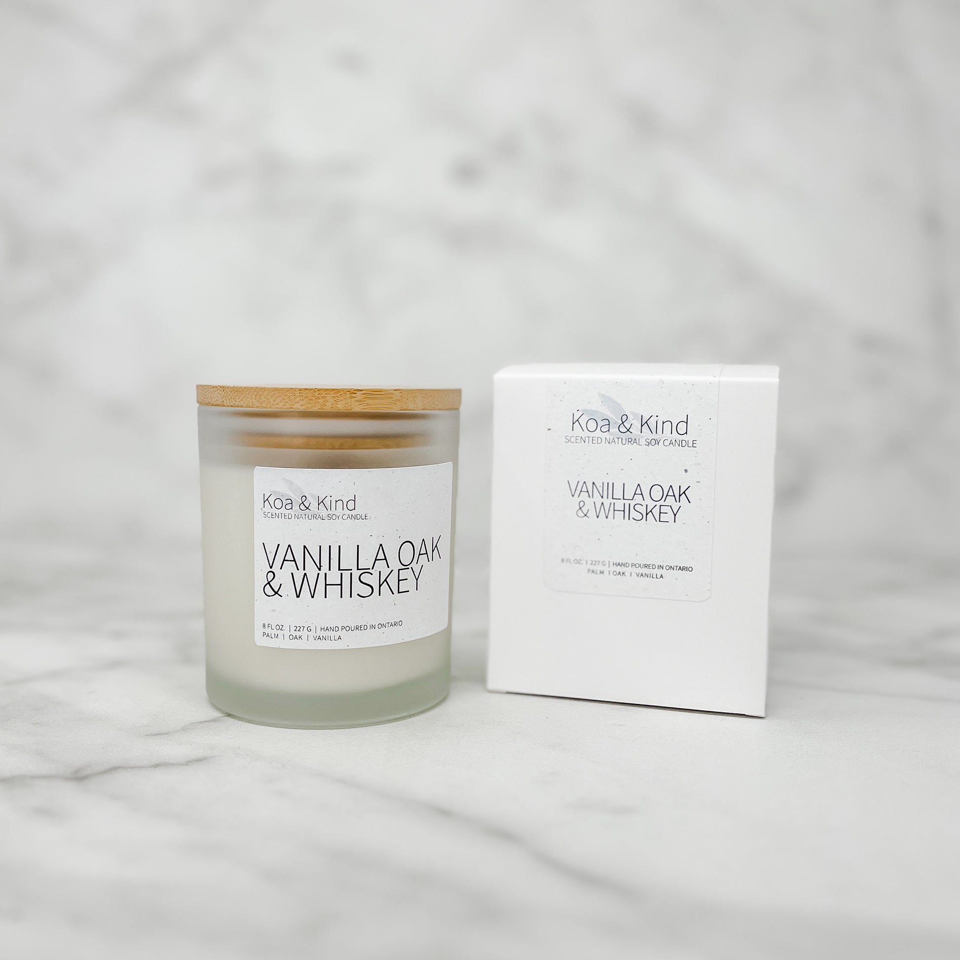 Koa & Kind Vanilla Oak & Whiskey candle with packaging on a light gray background